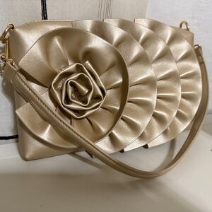 Melie Blanco gold floral clutch